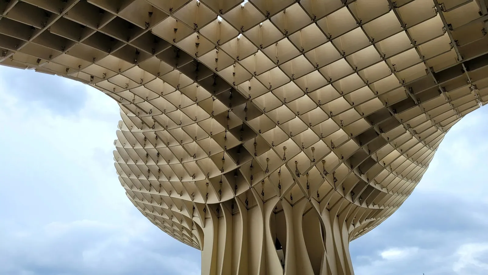 The timber lattice of the Metropol Parasol in Seville against the sky