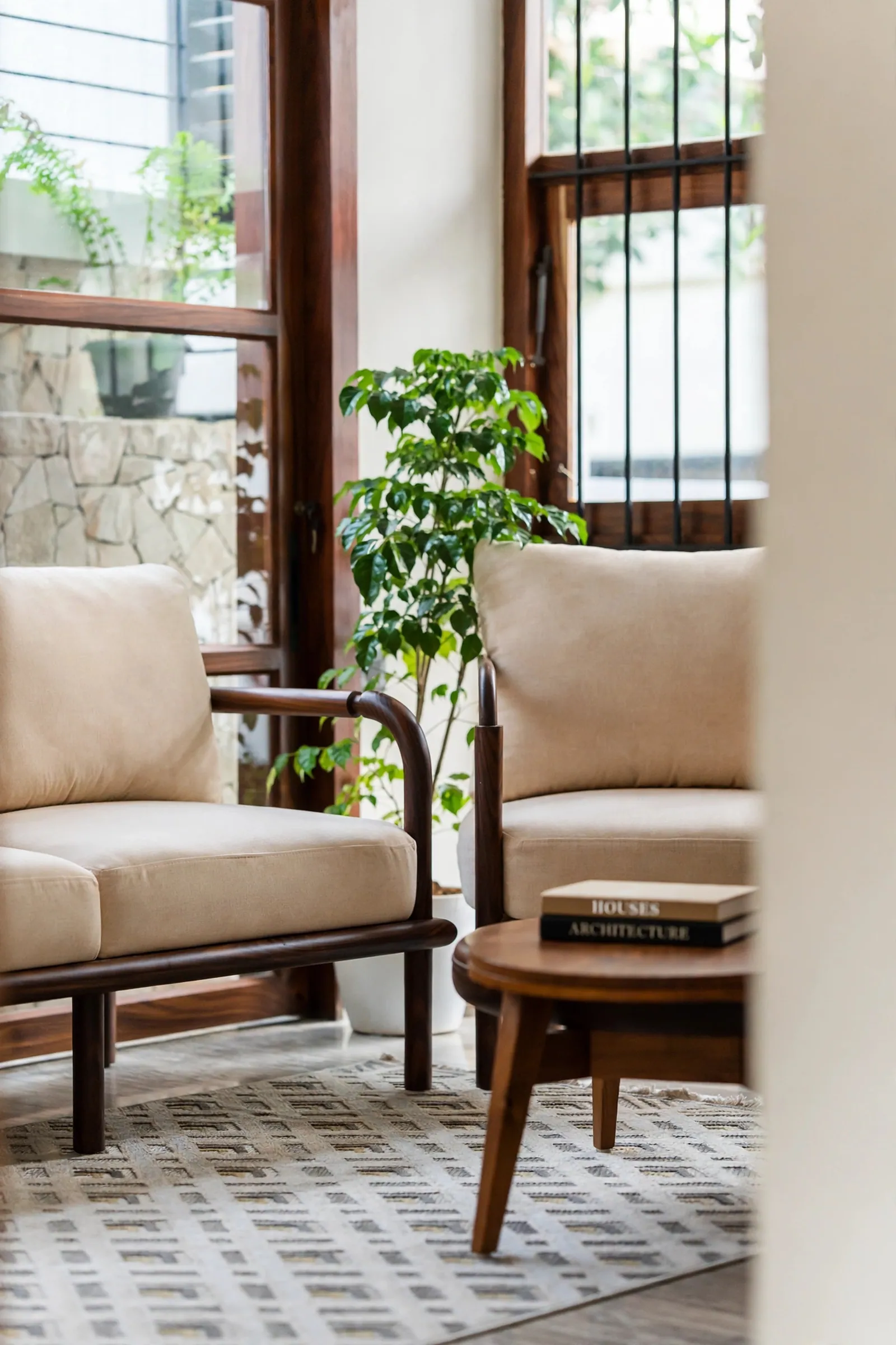 A corner of the living room, timber and linen against stone