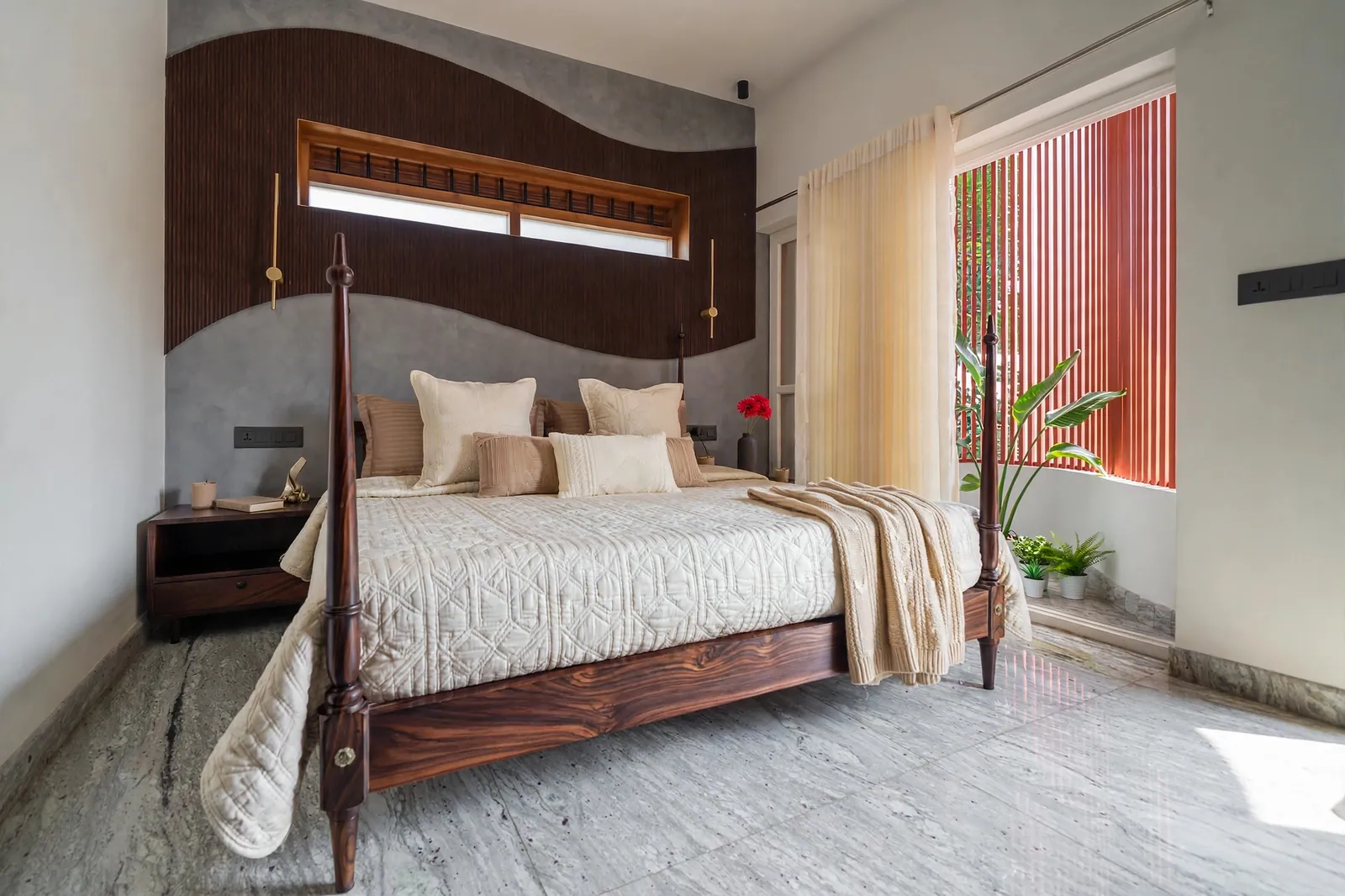 The main bedroom, with a curved timber headwall