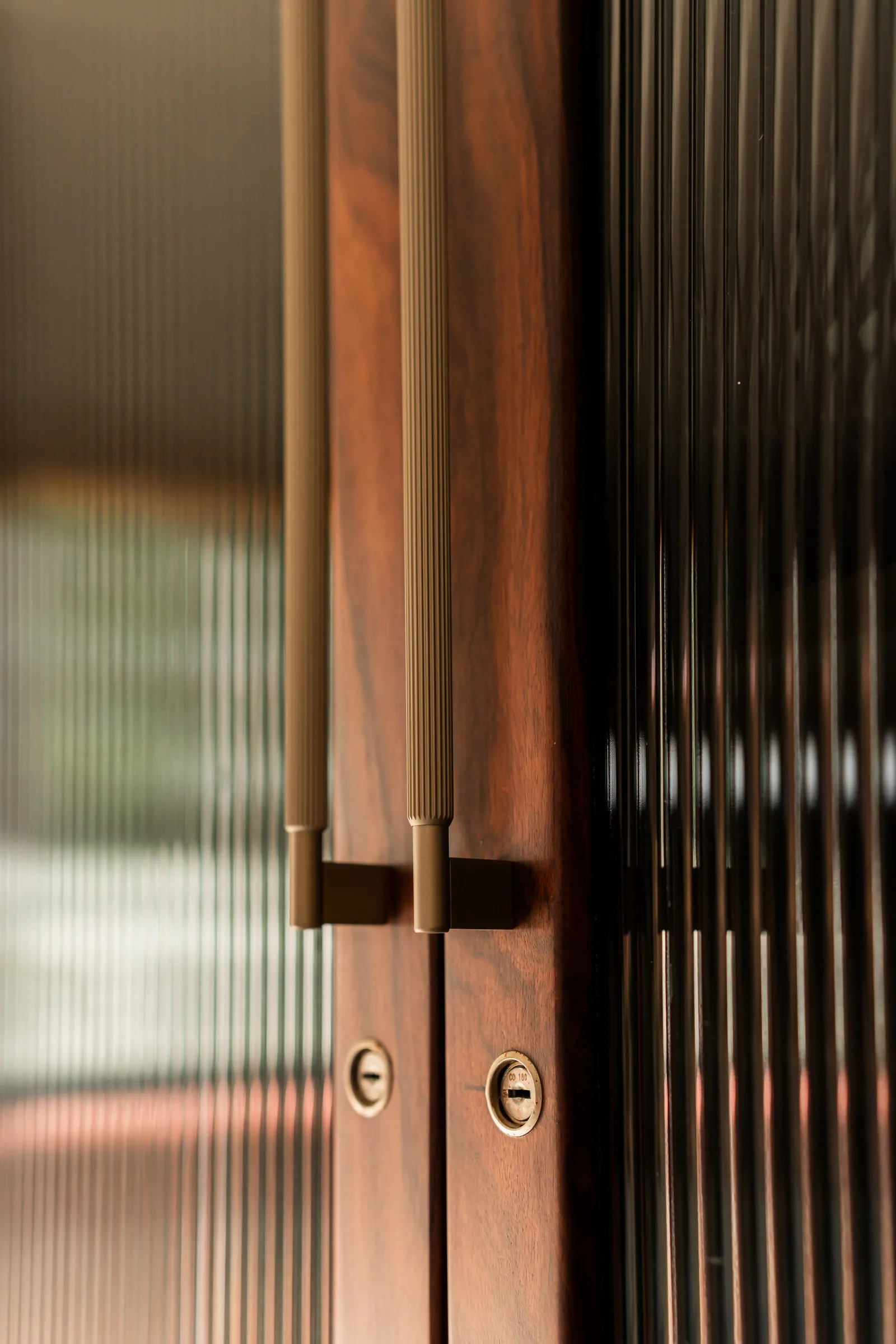Timber and fluted glass at the door