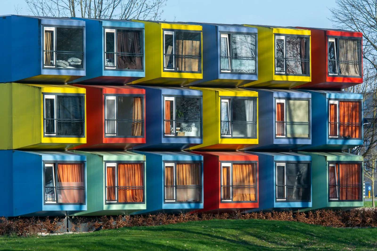 Colorful modular housing units demonstrating repeatable building systems.