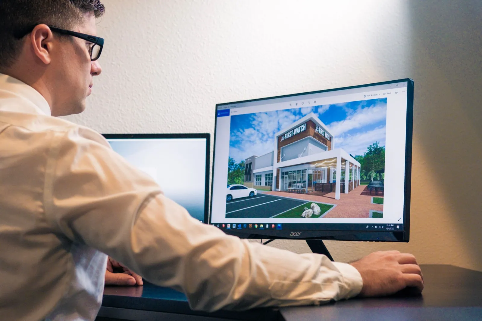 Architect reviewing a building design on a computer screen
