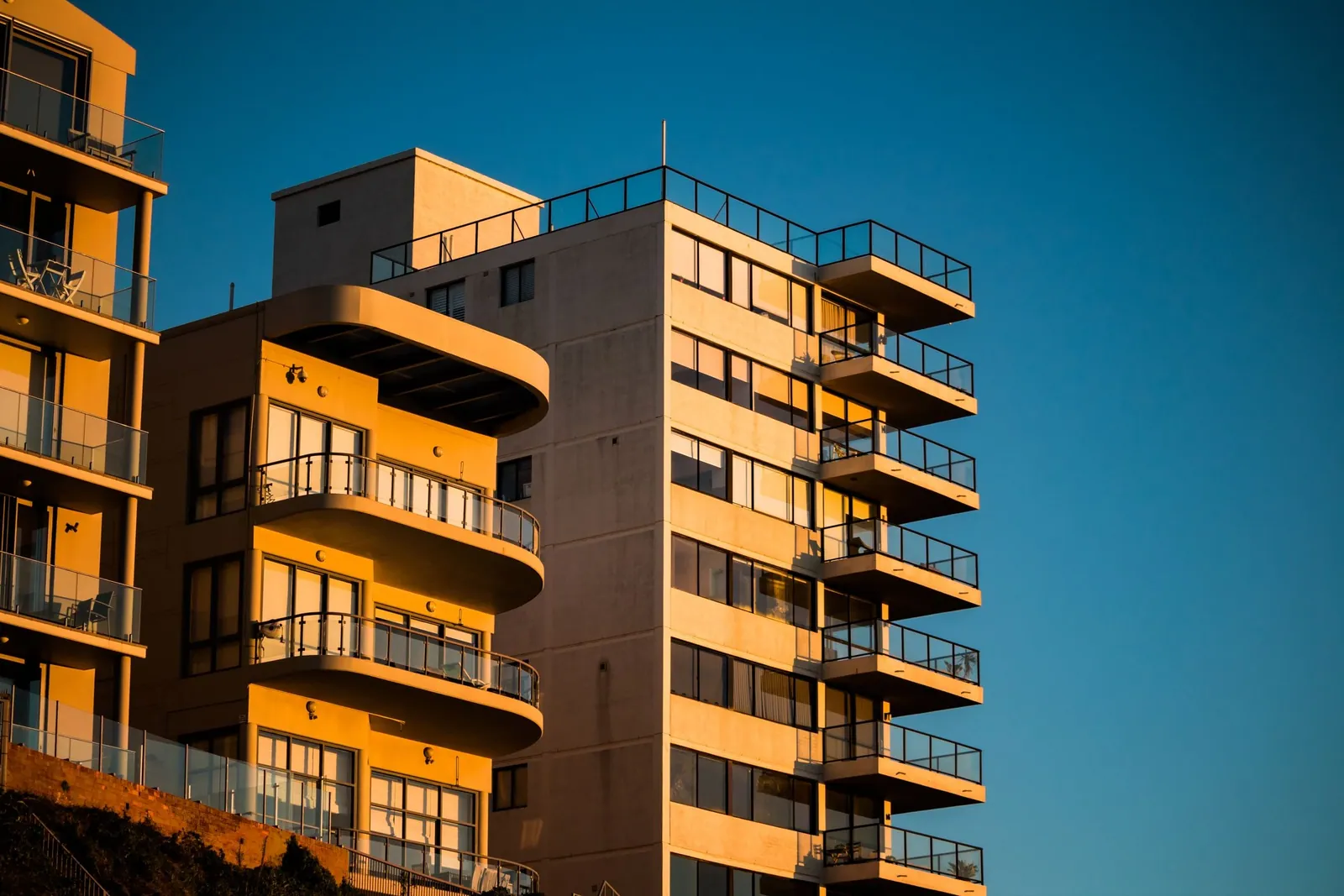 Apartment buildings illuminated by evening sunlight